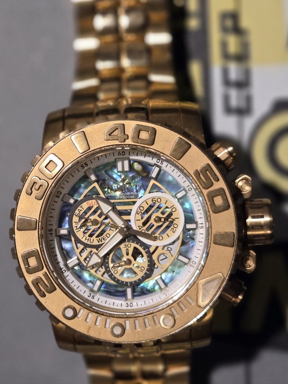 Invicta Gold Chronograph Watch with Mother-of-Pearl Dial